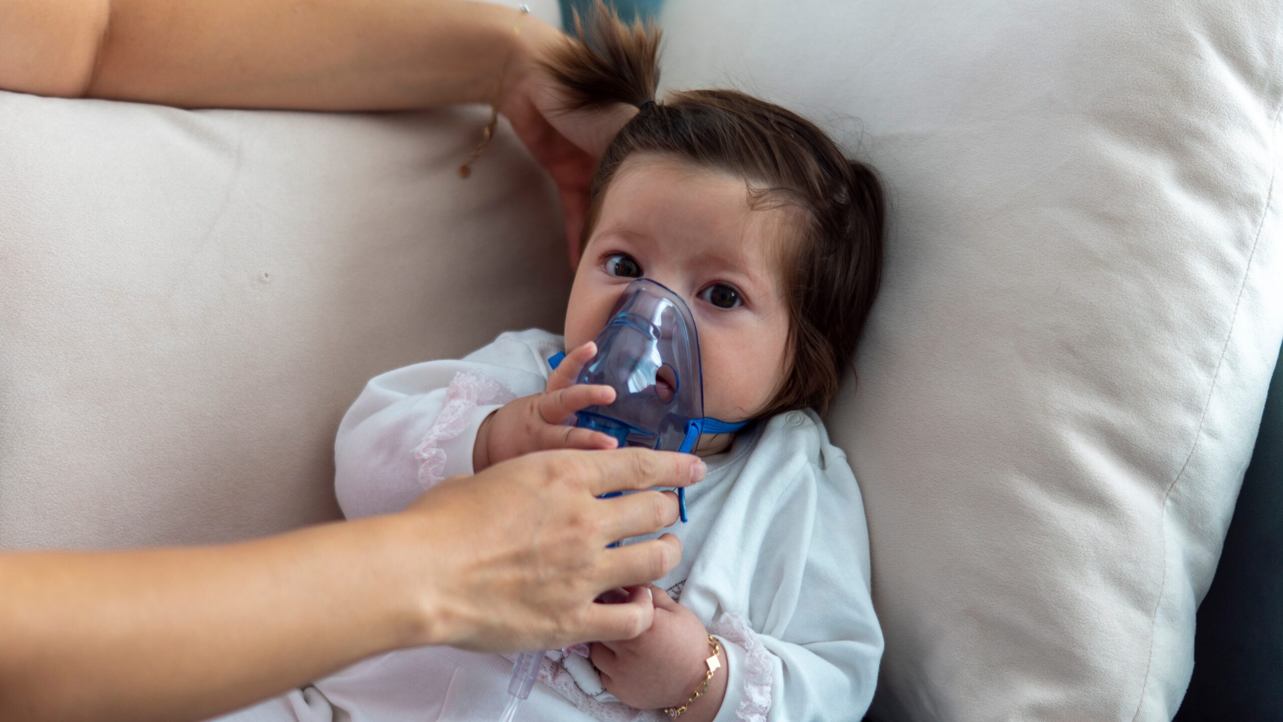 Baby using nebulizer for Cystic Fibrosis